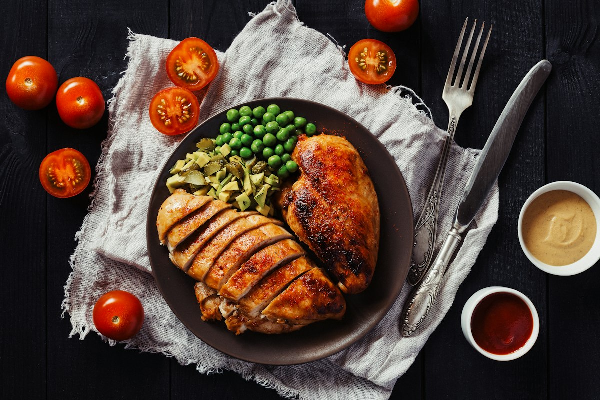 Sliced crispy chicken breast served with vegetables
